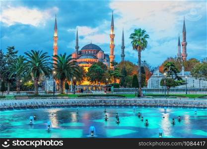 The Sultan Ahmet Mosque and the fountain in the blue shadows of sunrise, Istanbul.. The Sultan Ahmet Mosque and the fountain in the blue shadows of sunrise, Istanbul