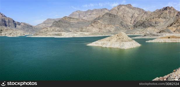 The Sultanate of Oman is a semi-arid country with limited water ressources with a fast growing population. The Dam will help to supply water to different region and it is located at 83 km from Muscat. The main Dam is 410 meter lenght with 75.43 meters height. Th total capacity of the reservoir is 100 Million m3.. Lake of Wadi Dayqah Dam, Sultanate of Oman