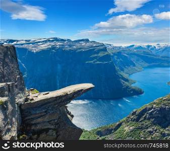 The summer view of Trolltunga (famous The Troll's tongue Norvegian destination) and Ringedalsvatnet lake in Odda, Roldal, Norway.