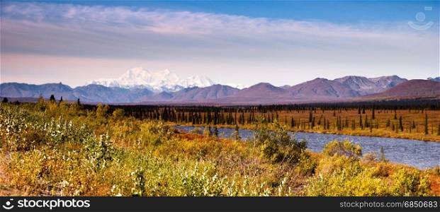 The sun finally rises but stays low in the sky hitting Mount McKinley and the Denali Range