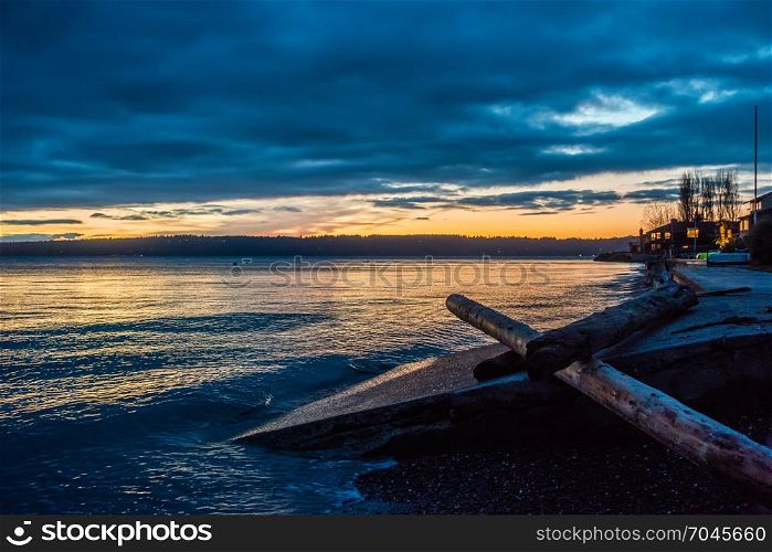 The sun is setting behind the Puget Sound in Washington State.