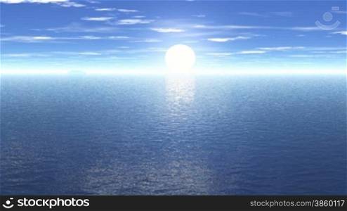The sun rises rapidly above the sea horizon. The camera moves towards the coast and shows the sun&acute;s reflection in the lake.