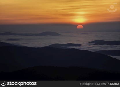 The sun rising over a sea of fog taken from Shenandoah National Park in Virginia on an early June morning.