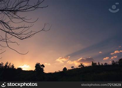 The sun sets behind the hills, chill out images