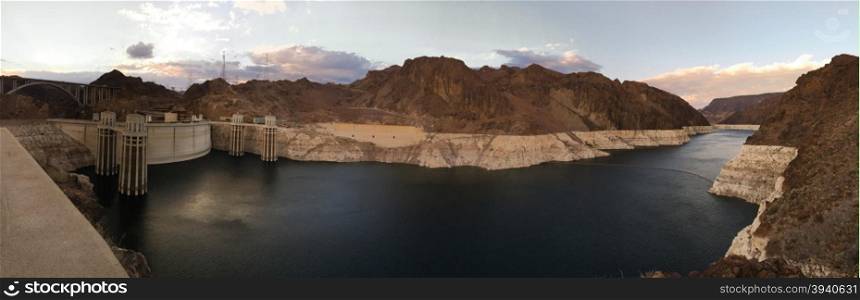 The sun sets on Nevada and the rugged terrain around Hoover Dam