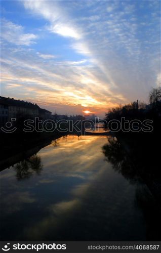 The sun setting over the River, Timisoara, Romania.
