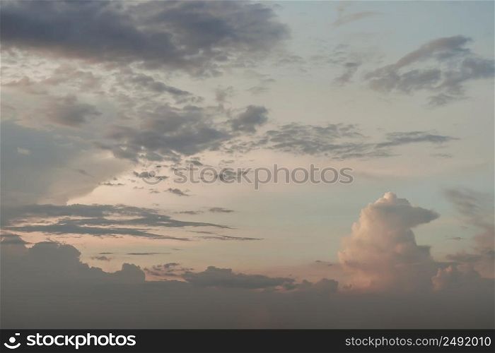 The sun shines through the clouds in the sunset sky with dramatic light. The shape of the clouds evokes imagination and creativity. They can be used as wallpapers that look amazing. Selective focus.