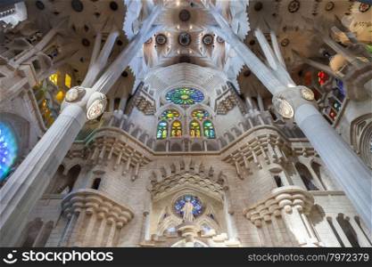 The sun shines through the stained glass windows of Gaudi&rsquo;s masterpiece: La Sagrada Familia
