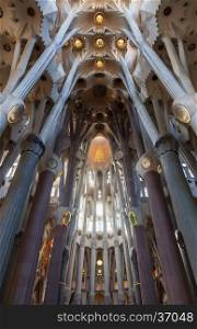 The sun shines through the stained glass windows of Gaudi's masterpiece: La Sagrada Familia