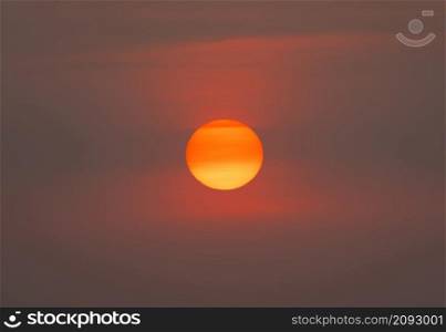 The Sun with sunset sky. Abstract nature background. Dramatic blue with orange colorful clouds in twilight time.