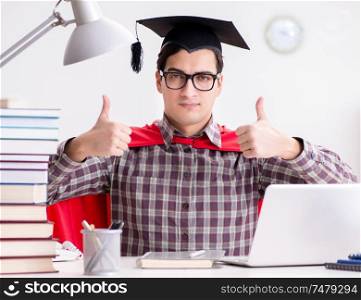 The super hero student wearing a mortarboard studying for exams. Super hero student wearing a mortarboard studying for exams