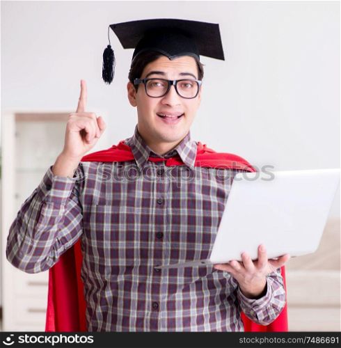 The super hero student wearing mortarboard and holding a laptop. Super hero student wearing mortarboard and holding a laptop