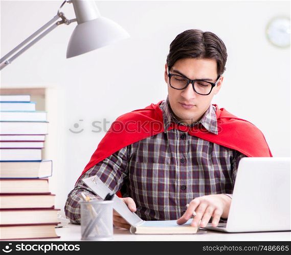 The super hero student with a laptop studying preparing for exams. Super hero student with a laptop studying preparing for exams
