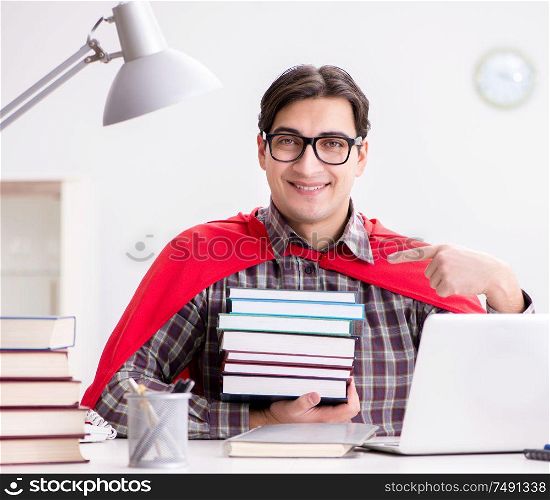 The super hero student with a laptop studying preparing for exams. Super hero student with a laptop studying preparing for exams
