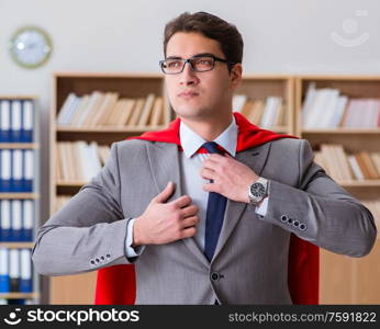The superhero businessman working in the office. Superhero businessman working in the office