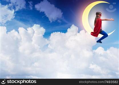 The superhero kid sitting on the moon crescent. Superhero kid sitting on the moon crescent