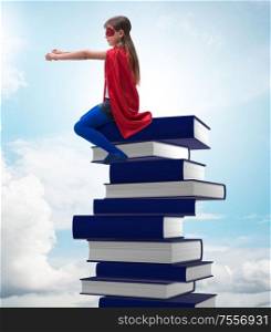 The superhero little girl in education concept. Superhero little girl in education concept