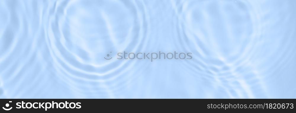 The surface of light on the blue transparent swimming pool water with water circles. Trendy abstract wavy background. Water waves in sunlight banner. Long banner with copy space.. The surface of light on the blue transparent swimming pool water with water circles. Trendy abstract wavy background. Water waves in sunlight banner. Long banner with copy space