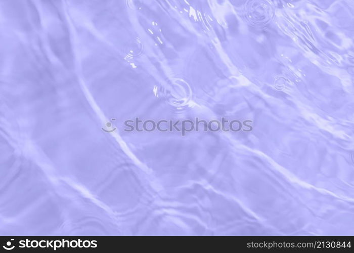 The surface of light on the purple transparent swimming pool water. Abstract wavy background. Water waves in sunlight banner. Trendy banner with 2022 color of the year very peri.. The surface of light on the purple transparent swimming pool water. Abstract wavy background. Water waves in sunlight banner. Trendy banner with 2022 color of the year very peri