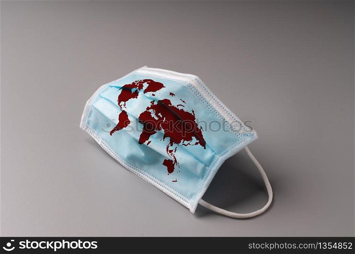 The surgery mask with world map icon for epidemic concept & COVID 19 virus