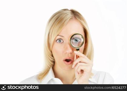 The surprised girl looks in a magnifier, isolated. Who here?