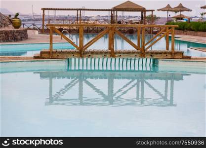 The swimming pool with blue water