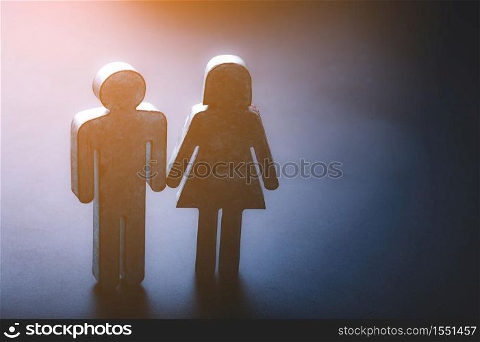The symbol of couple is made of metal zinc on black background, lovers couple concept