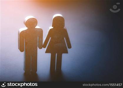 The symbol of couple is made of metal zinc on black background, lovers couple concept