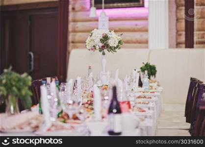 The tables are lined with them dishes of food.. Festively decorated table with dishes 627.. Festively decorated table with dishes 627.