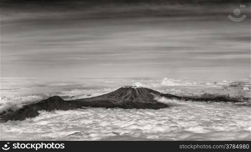 The tallest mountain in Africa, Mount Kilimanjaro, soaring above the clouds
