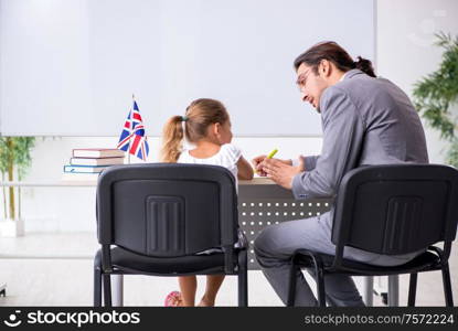 The teacher with young girl in the classroom. Teacher with young girl in the classroom