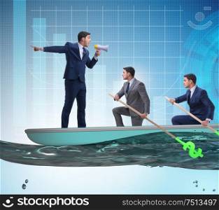 The team of businessmen in teamwork concept with boat. Team of businessmen in teamwork concept with boat