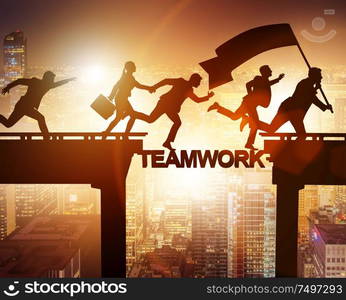 The teamwork concept with business people crossing bridge. Teamwork concept with business people crossing bridge