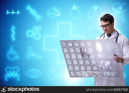 The telemedicine concept with doctor looking at x-ray image. Telemedicine concept with doctor looking at x-ray image. The telemedicine concept with doctor looking at x-ray image