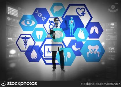 The telemedicine concept with doctor pressing virtual buttons. Telemedicine concept with doctor pressing virtual buttons. The telemedicine concept with doctor pressing virtual buttons