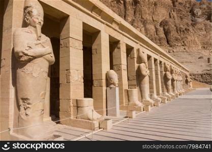 The temple of Hatshepsut near Luxor in Egypt. Statues of Queen Hatshepsut as Osiris, the god of the dead, at her temple in Luxor