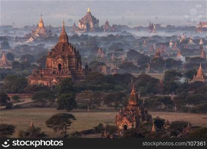 The temples of the Archaeological Zone in Bagan in the early morning sunlight. Myanmar (Burma).