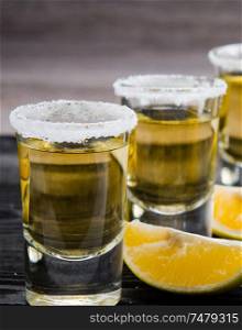 The tequila drink served in glasses with lime and salt. Tequila drink served in glasses with lime and salt