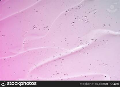 The texture of a cosmetic gel with bubbles on a white background.