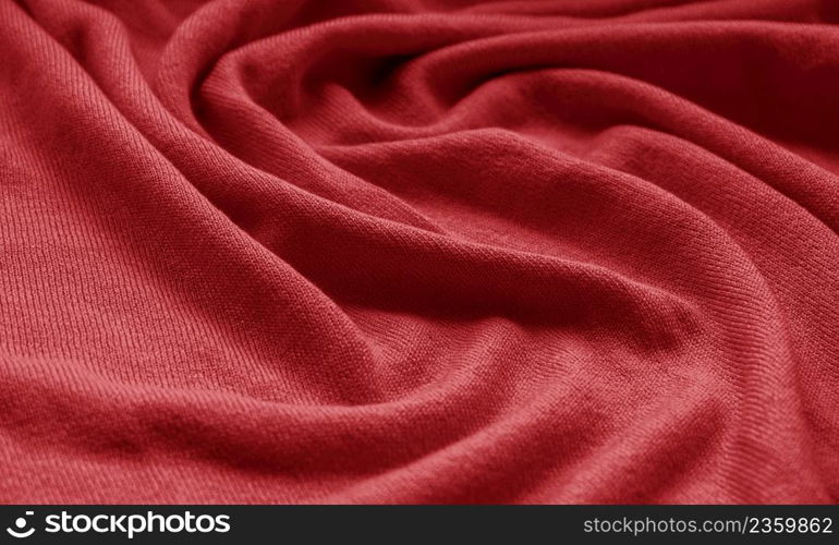 The texture of a knitted woolen fabric red.
