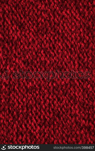 The texture of a knitted woolen fabric red.