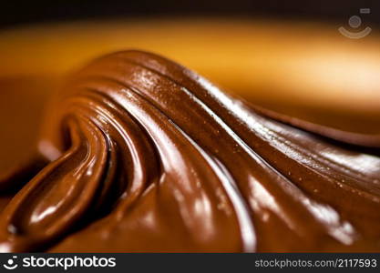 The texture of hazelnut butter. Macro background. High quality photo. The texture of hazelnut butter.