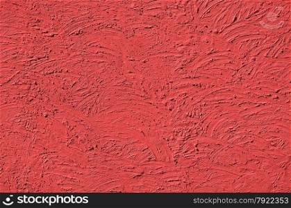 The texture of Light red walls painted large erratic strokes of pain