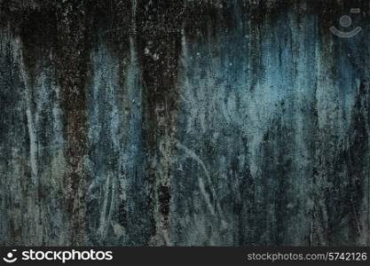 The texture of old concrete green wall closeup