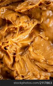 The texture of peanut butter. Macro background. High quality photo. The texture of peanut butter.