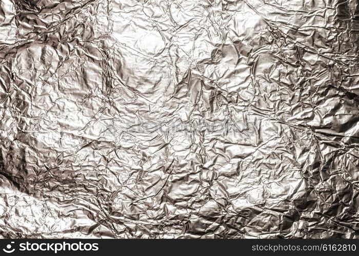 The texture of shiny aluminum foil close up