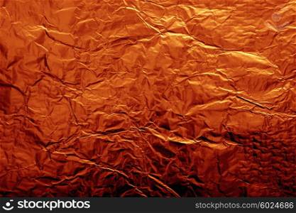 The texture of shiny copper foil close up