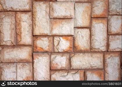 The texture of the wall of the large beige stones