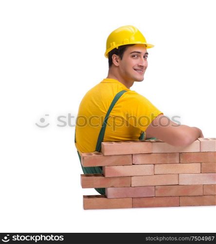 The the handsome construction worker building brick wall. The handsome construction worker building brick wall