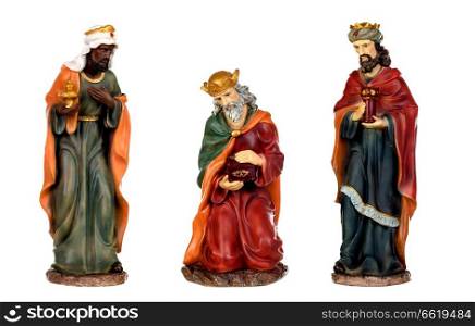 The three wise men and baby Jesus. Ceramic figures isolated on white background